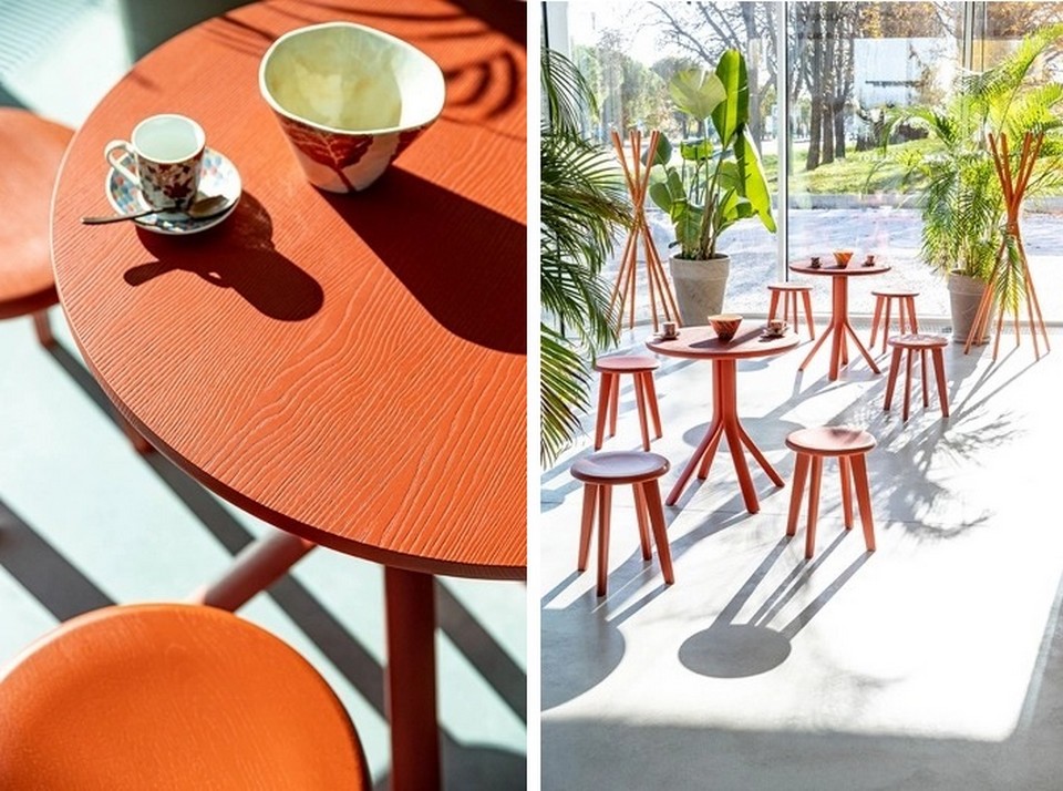 Zoom sur le veinage du bois massif d'une table TREE finition orange terracotta.